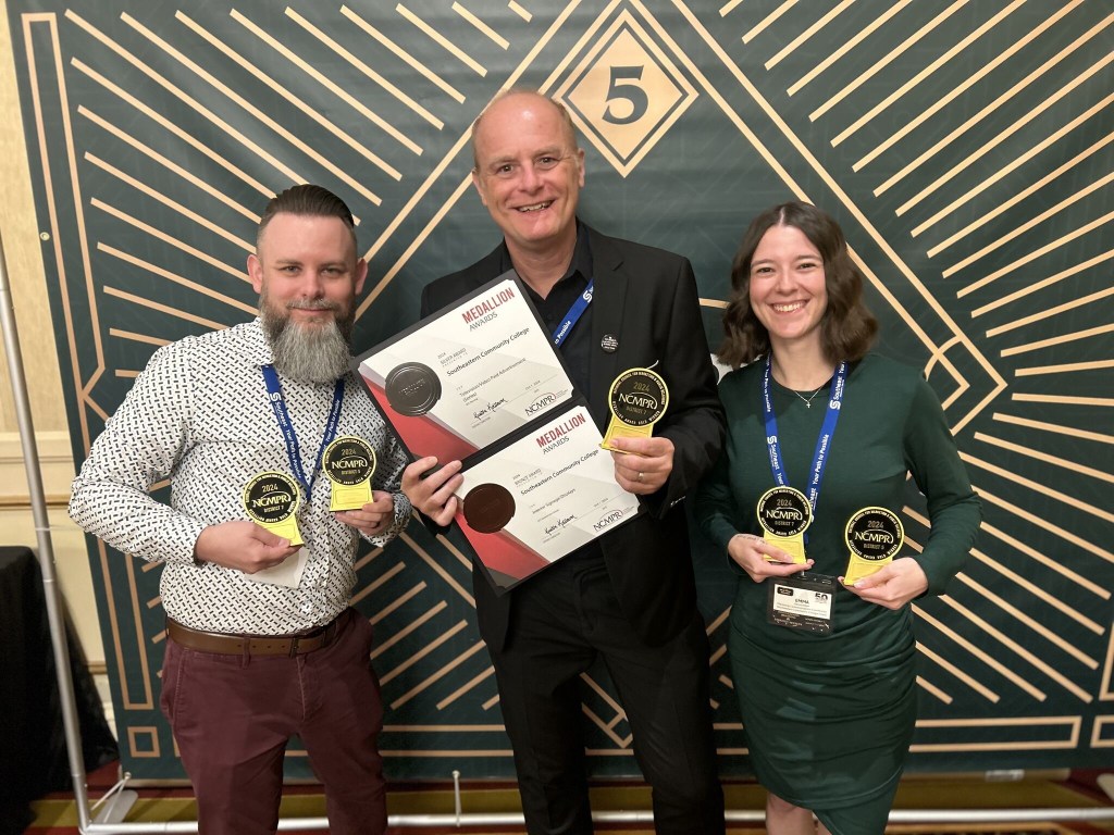 SCC team celebrate a hard-fought win with our Medallion haul, including Gold for website.